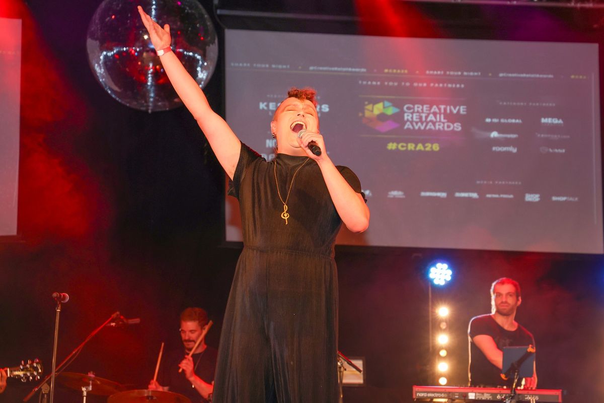 Our host performing on stage at The Clapham Grand