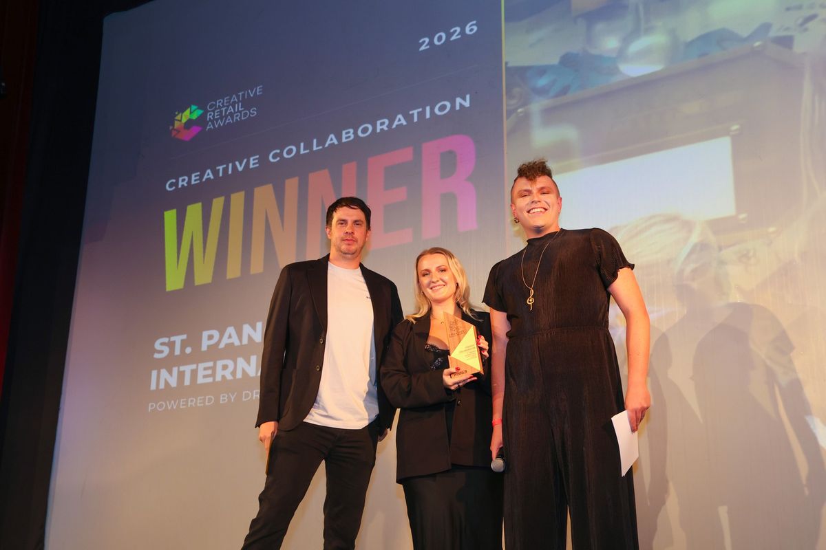 A winning team collecting their award on stage