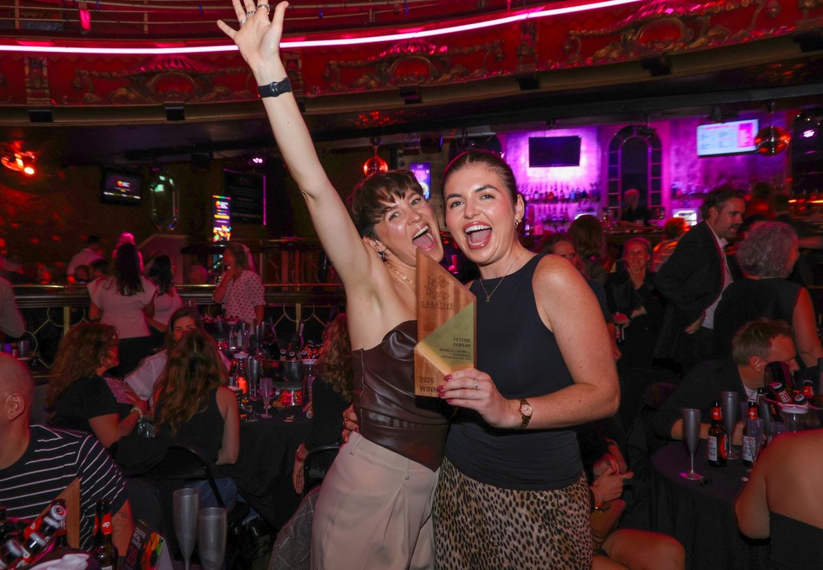 A winner celebrating with her award