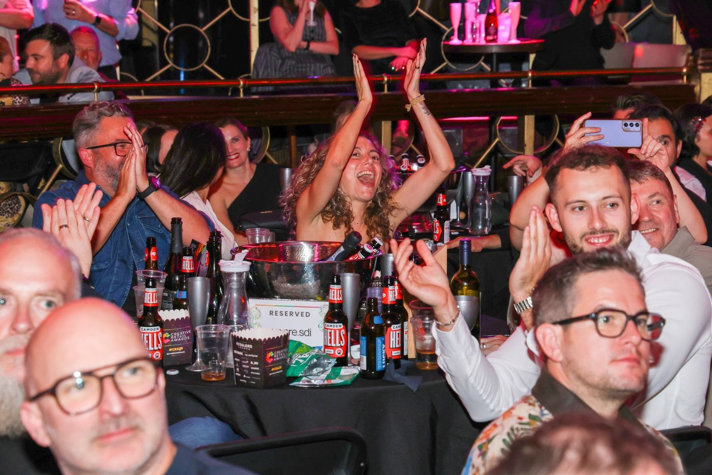 Guests cheering at their tables