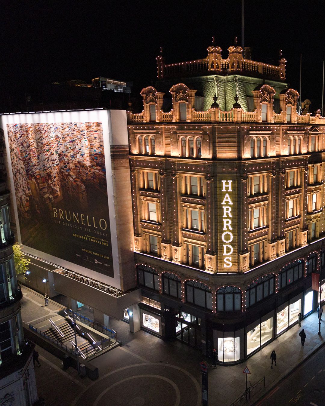 The Brunello Cucinelli takeover on the Harrods façade at night